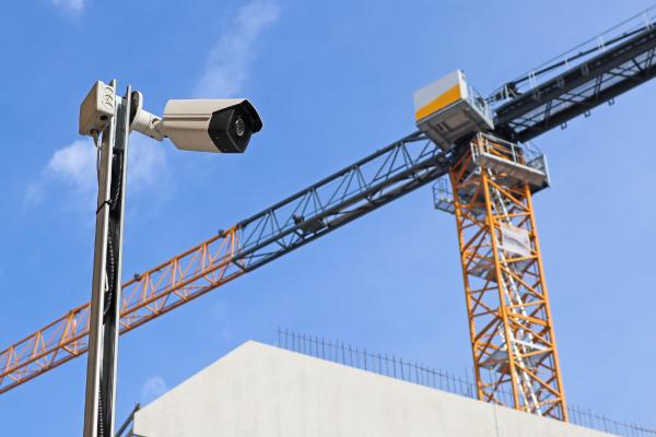 Construction Site Surveillance A security camera operating at a construction site with a crane in the background