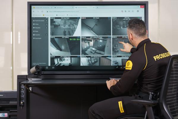 Reviewing Security Footage A Prosegur security officer reviewing workplace security footage